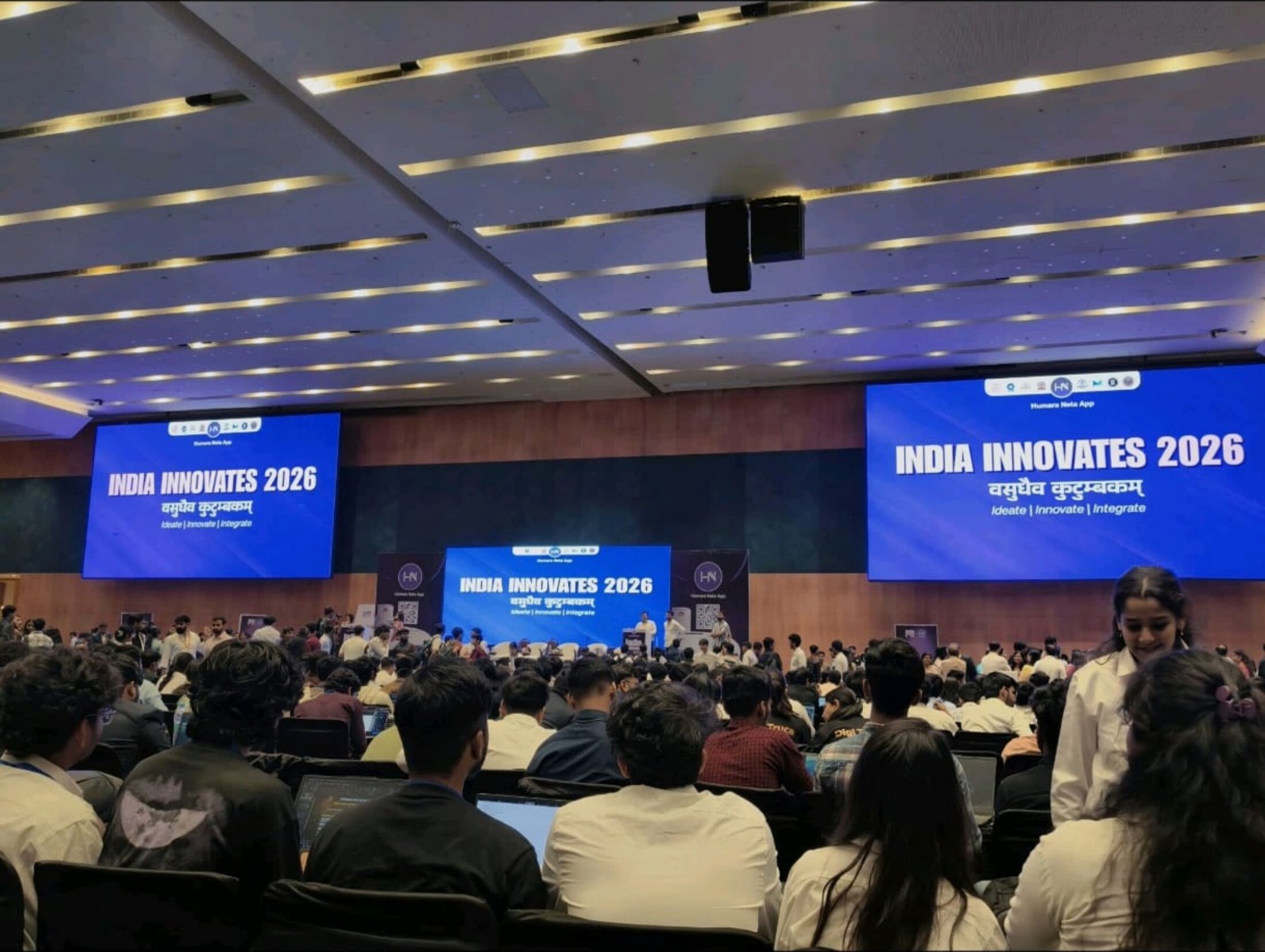 India Innovates 2026 event hall with large screens and participants